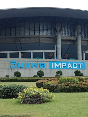 A building with a large sign reading 'SWING IMPACT'.