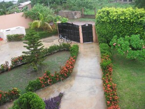 Stroll through the beautifully maintained outdoor space, surrounded by lush greenery and vibrant flowers.