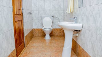 Bathtub, bathrobes, towels