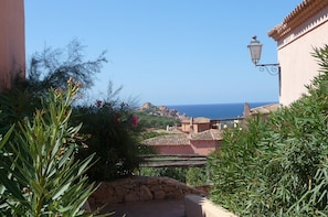 Experience a serene Mediterranean retreat with a tranquil atmosphere, surrounded by lush greenery and the soothing sound of the sea.