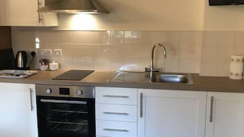 Cottage | Private kitchen | Electric kettle, highchair