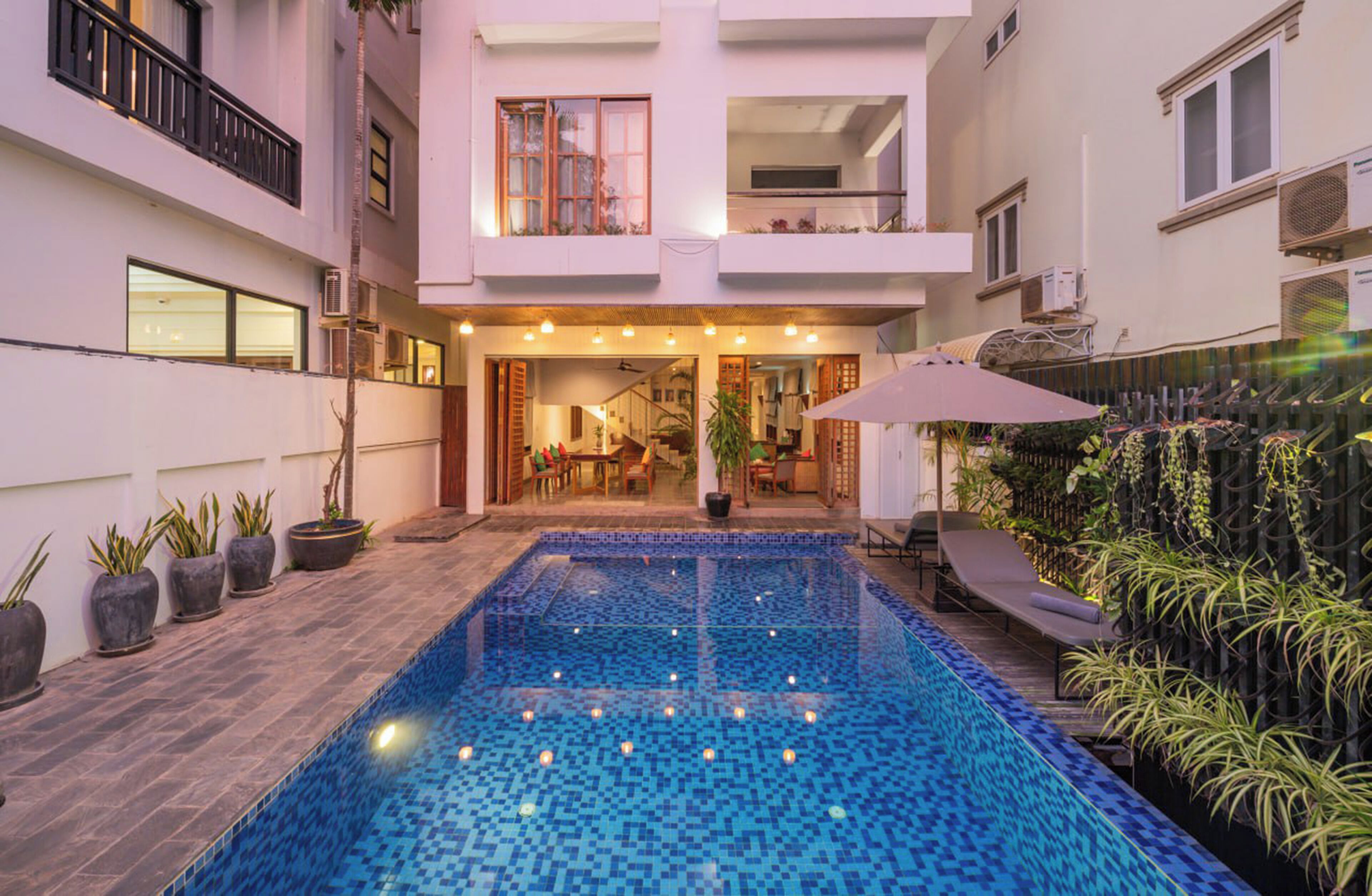 2 outdoor pools, open 8:00 AM to 9:00 PM, pool umbrellas, pool loungers