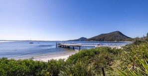 Walk along the pier and enjoy the tranquil views of the calm waters and surrounding landscape.