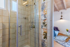 Shower, hair dryer, towels, soap