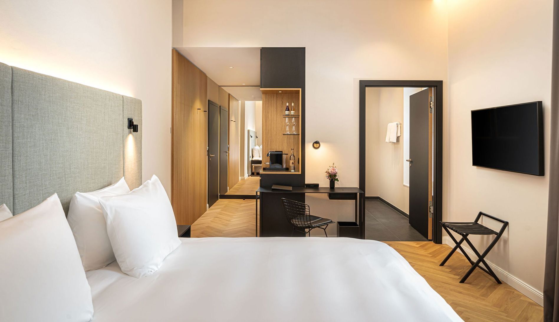 Premium bedding, down comforters, pillowtop beds, minibar