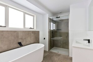 Bathtub, hair dryer, towels
