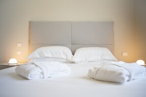 Frette Italian sheets, premium bedding, down duvets, minibar