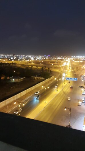 A nighttime highway scene with multiple lanes and vehicles. - RED- Razat Alard 2 (Salalah)