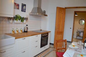 Fridge, oven, electric kettle, cookware/dishes/utensils
