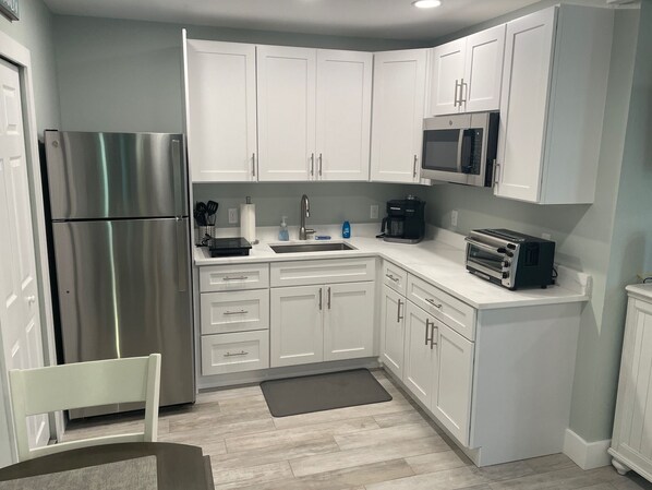 Fridge, microwave, stovetop, coffee/tea maker