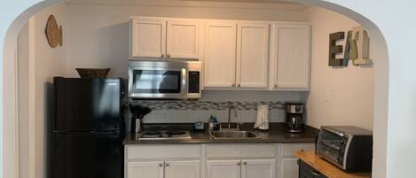 Fridge, microwave, stovetop, coffee/tea maker