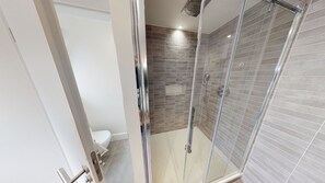 Shower, hair dryer, towels, toilet paper