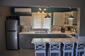 Fridge, microwave, stovetop, coffee/tea maker