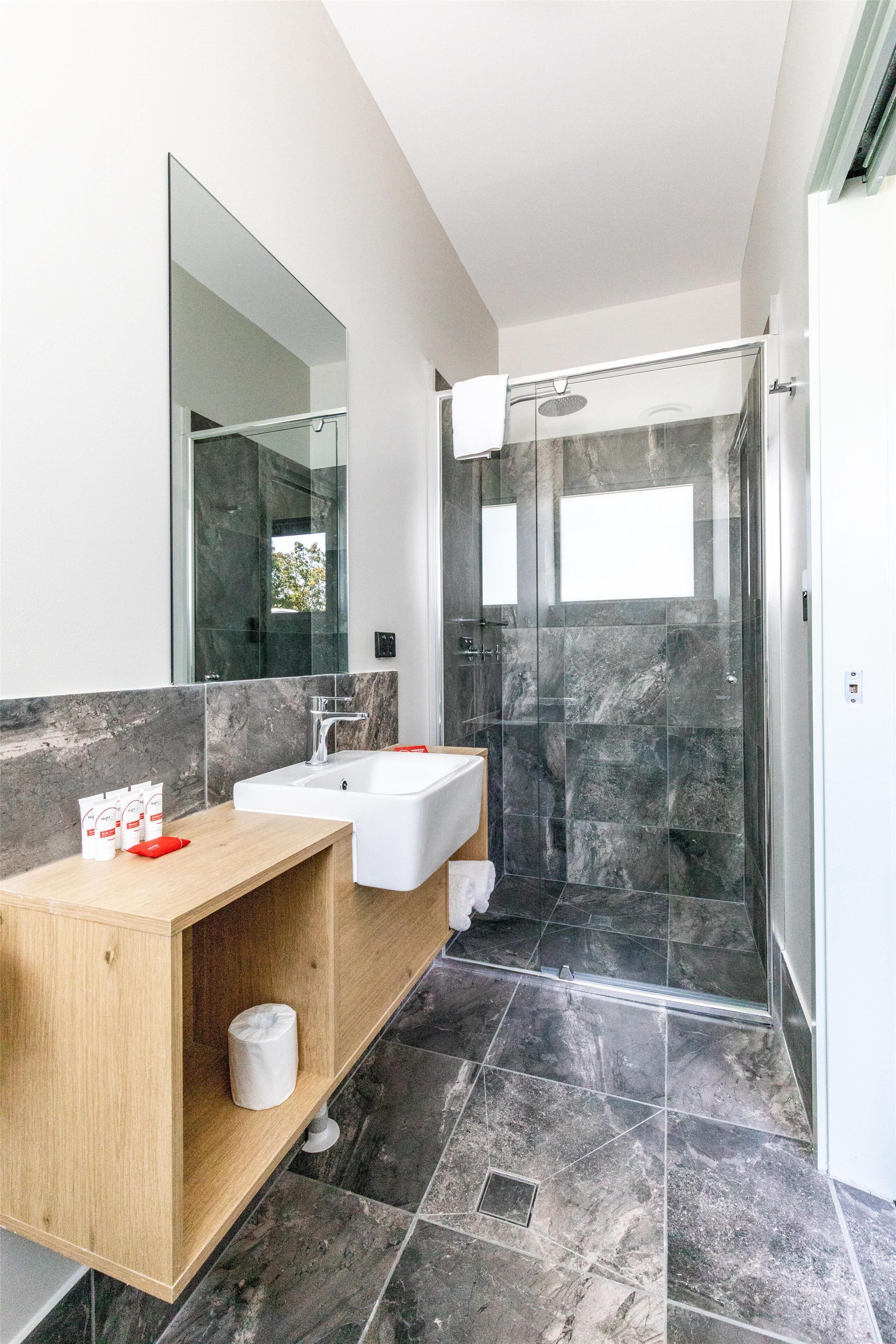 studio queen | bathroom | shower, rainfall showerhead, free toiletries, hair dryer