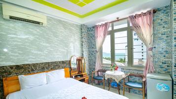 Deluxe Double Room, Sea View | 1 bedroom, minibar, desk, blackout drapes