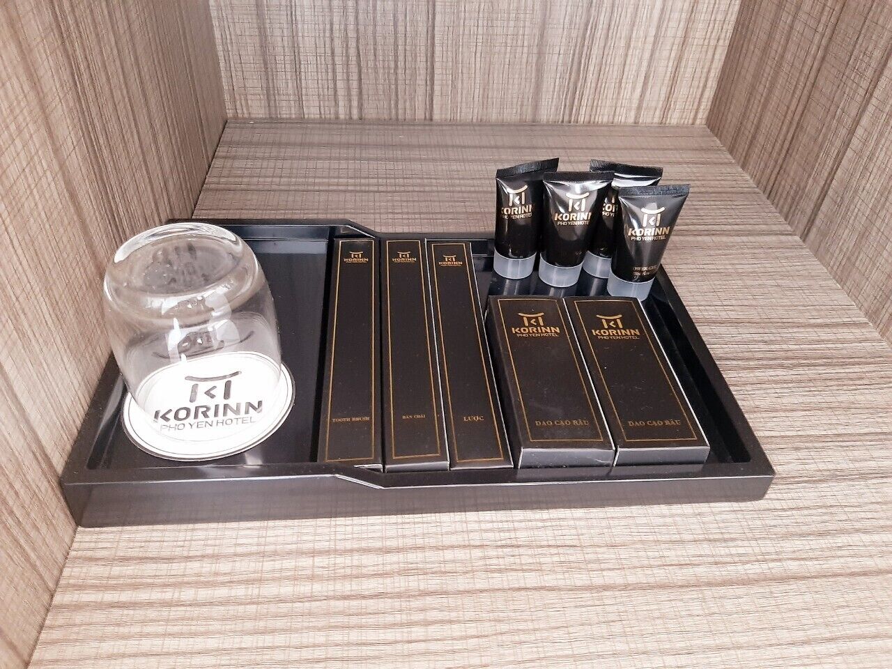 A tray with Korinn products, including a jar, tubes, and boxes.