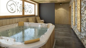 A modern spa room with a large hot tub, wooden panel walls, and a stone wall with illuminated designs. - Willa Dziubas (Poronin)