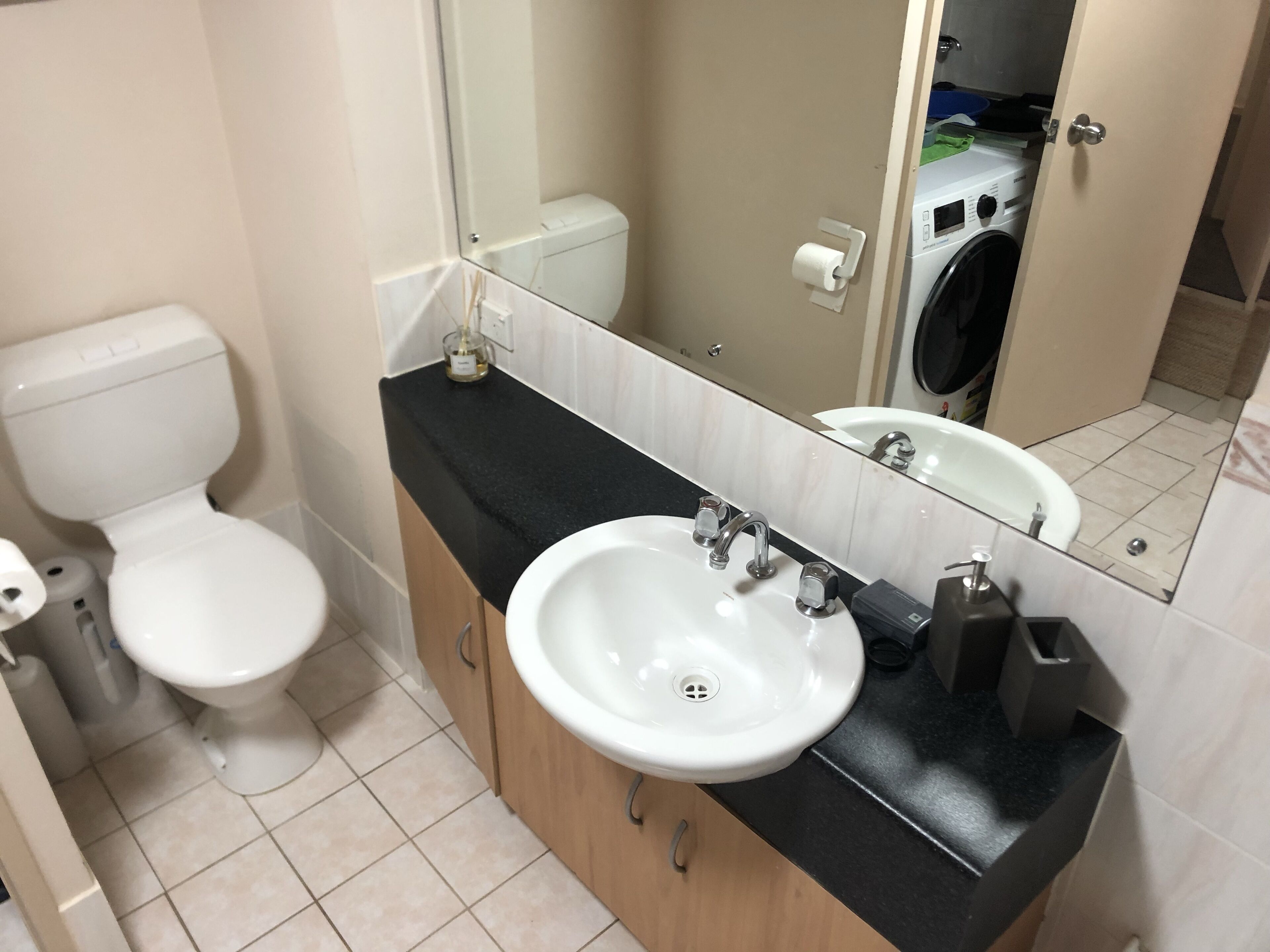 Bathtub, towels, soap, toilet paper