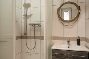 Shower, hair dryer, slippers, towels