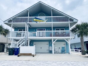 Enjoy stunning ocean views from the spacious balcony with a large fish sculpture.
