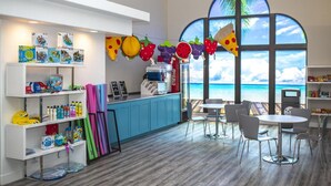 A children's play area with colorful toys and a view of the ocean. - Le Château at Las Palmas Resort - The nicest unit in the community!! (St. George)