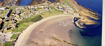 Beadnell Fantastic Bungalow - garden backs straight onto dunes and beach.
