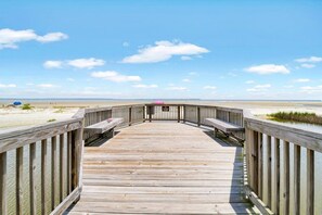 A wooden boardwalk leading to a beach with a clear sky. - Soundfront Stay Beach, Pools & More at The Spa (Hilton Head Island)