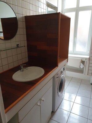 Shower, hair dryer, towels, toilet paper