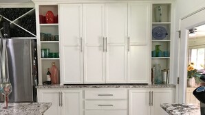 A kitchen with white cabinets, a stainless steel refrigerator, and a granite countertop. - Great Location close to everything (Texarkana)