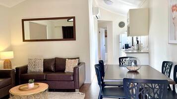 Spa Villa | Living area | 32-inch TV with digital channels, books