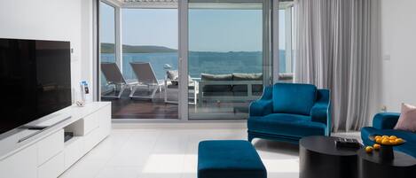 Luxury Apartment, 3 Bedrooms, Sea View (N5) | Living area | 50-inch flat-screen TV with satellite channels, TV, books