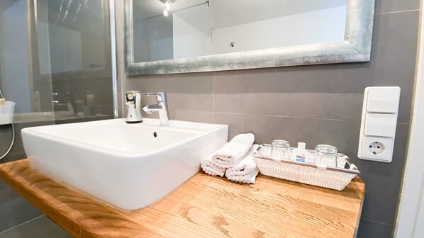 Shower, hair dryer, towels, toilet paper