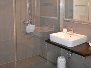 Shower, hair dryer, towels, toilet paper