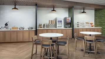 A modern cafe with wooden furniture, white tiled walls, and a herringbone floor pattern.