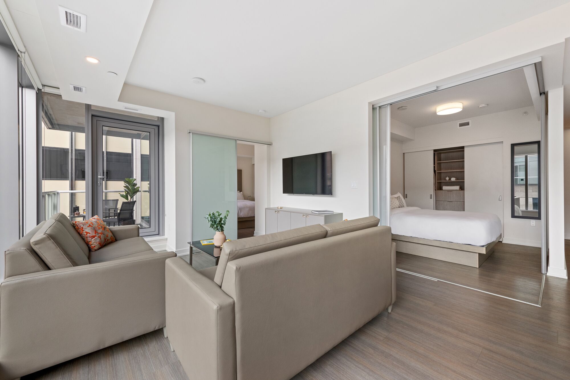 suite (signature large two bedroom balcony) | living area | 55-inch tv with satellite channels, streaming services