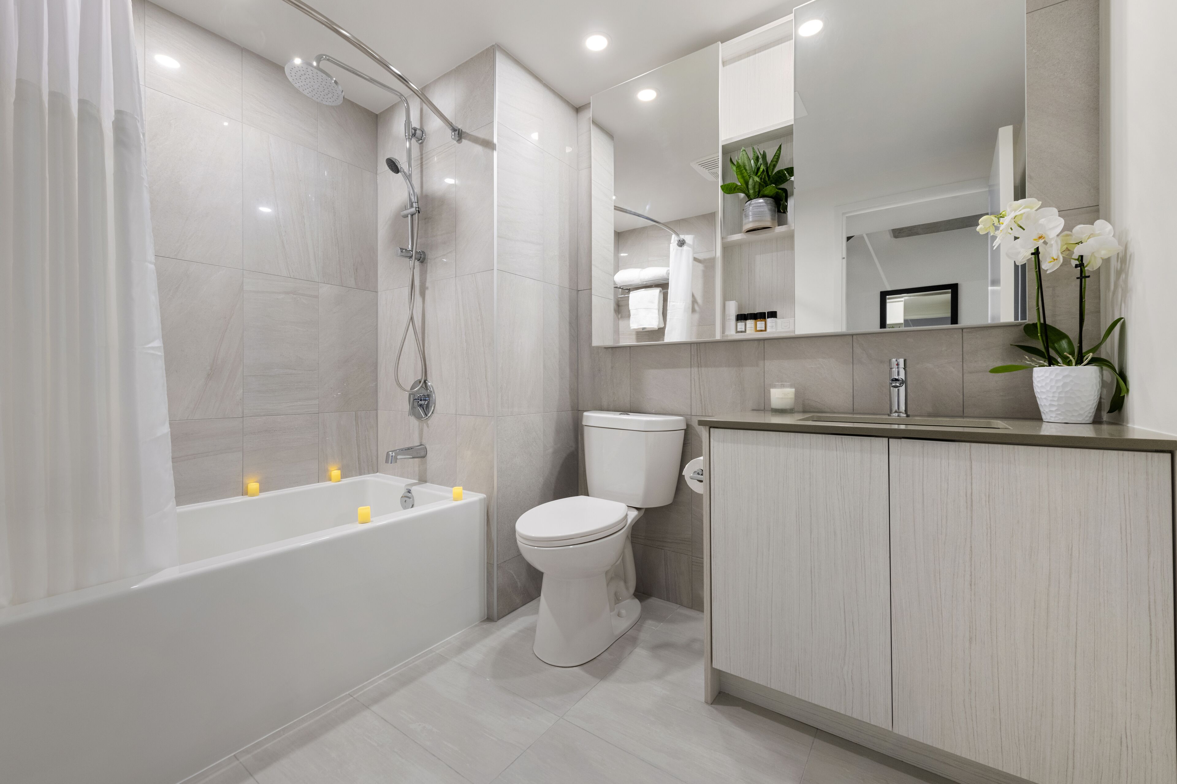 combined shower/bathtub, rainfall showerhead, designer toiletries