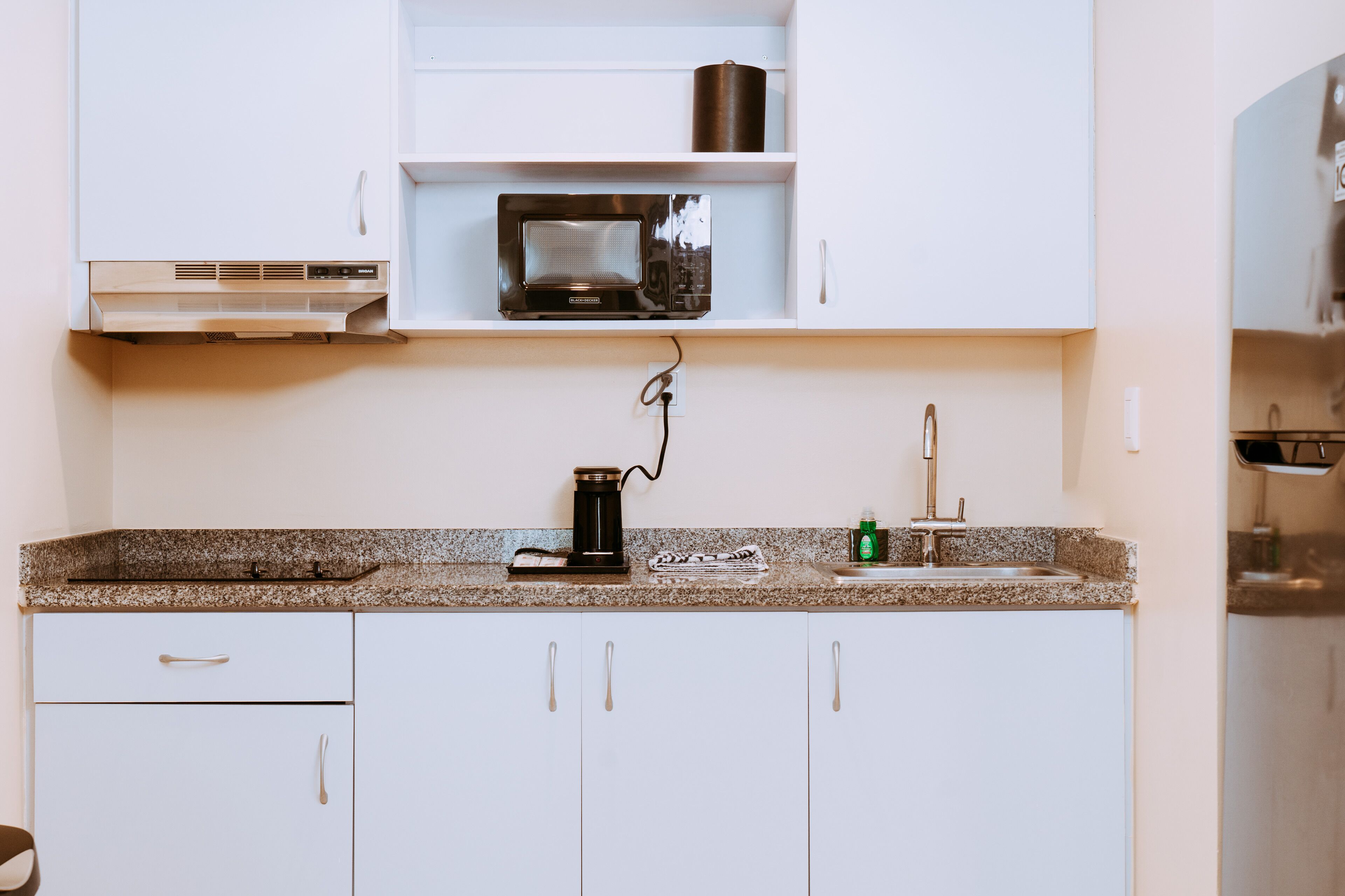 microwave, coffee/tea maker, dining tables