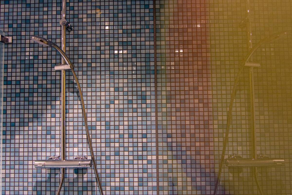 junior double room | bathroom | shower, rainfall showerhead, free toiletries, hair dryer