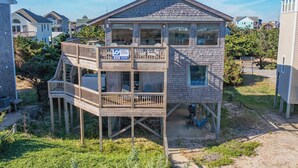 A two-story house with a balcony and a garage.