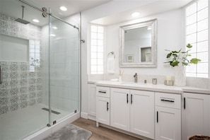 Shower, hair dryer, towels, soap