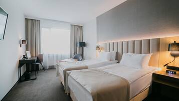 Hypo-allergenic bedding, in-room safe, desk, laptop workspace