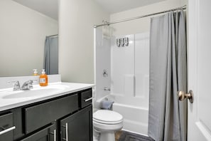 Combined shower/tub, hair dryer, towels, soap