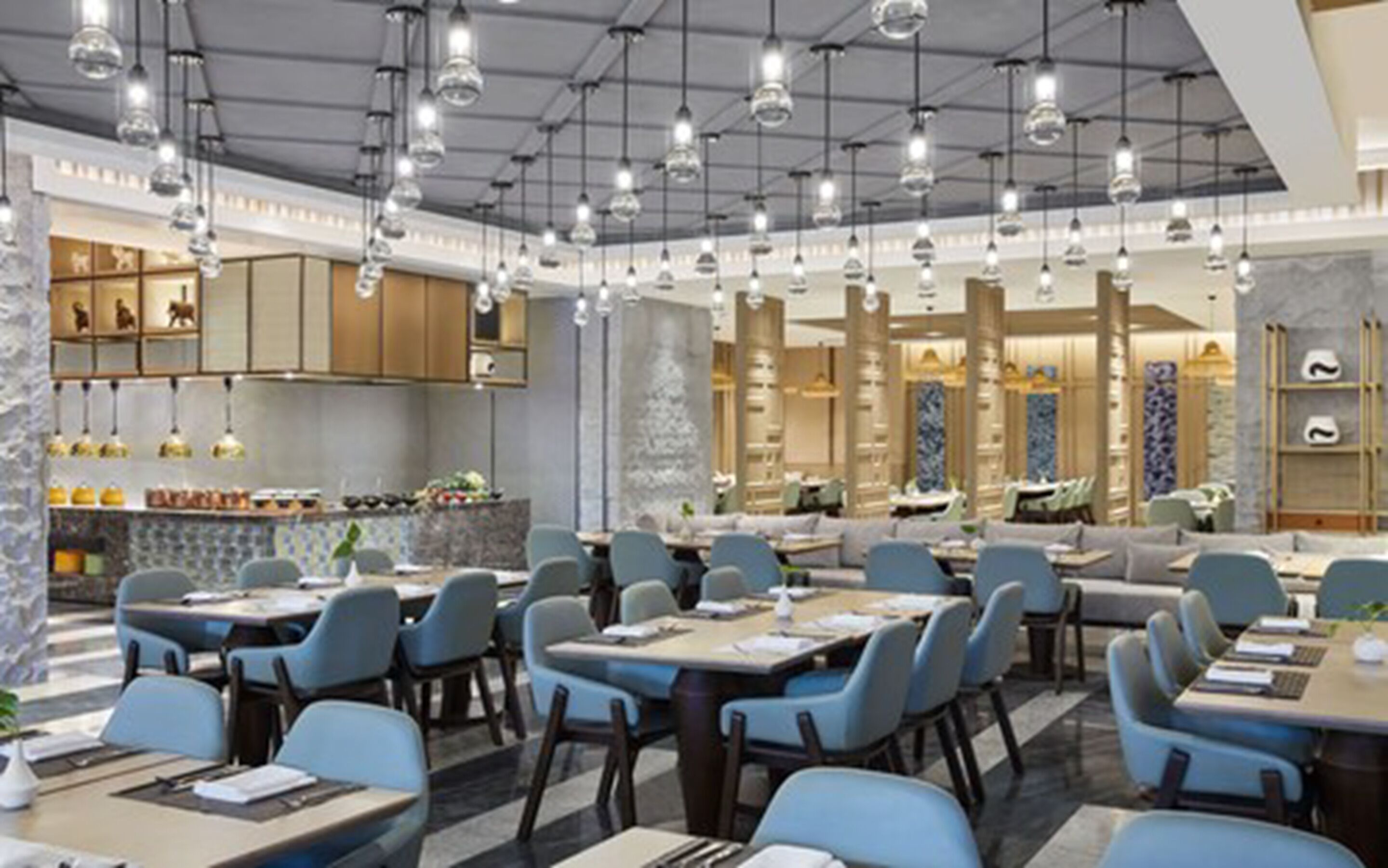 A modern restaurant with multiple dining areas, including a bar and a seating area with tables and chairs.