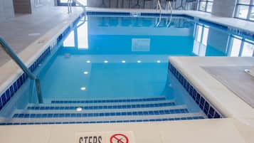 Indoor pool, open 9:00 AM to 9:00 PM, pool loungers