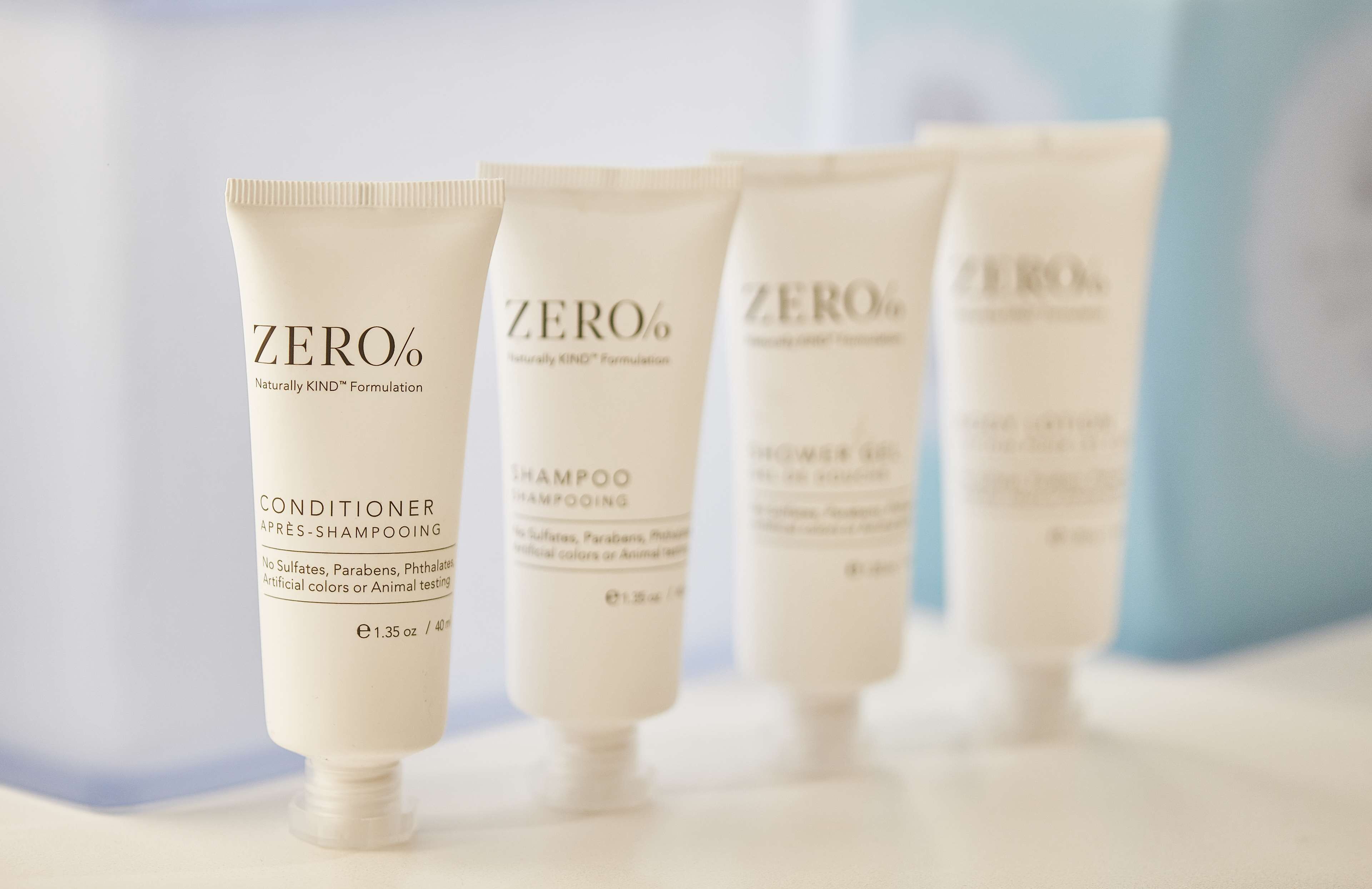 designer toiletries, hair dryer, towels, soap