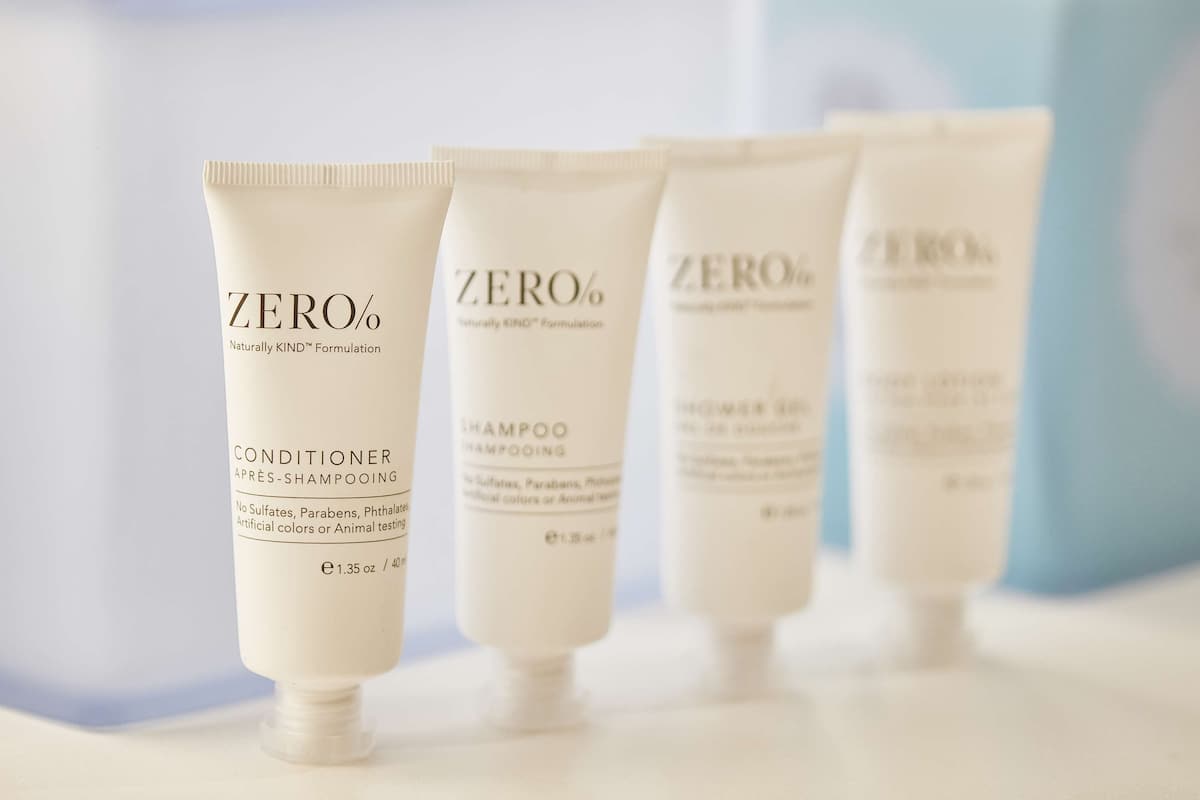 designer toiletries, hair dryer, towels, soap