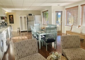 Enjoy a spacious living area with a kitchen, dining space, and comfortable seating for relaxation and socializing.