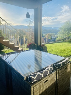 Relax in a serene hot tub with breathtaking views of the surrounding landscape.