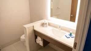 A modern bathroom with a white sink, a mirror, and a towel rack. - Holiday Inn Express & Suites Dayton North - Vandalia by IHG (Dayton)