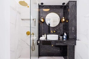 Shower, hair dryer, towels, shampoo